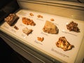 In the hall of exhibition centre shows a gold in different kind of the rocks, display in a glass case.